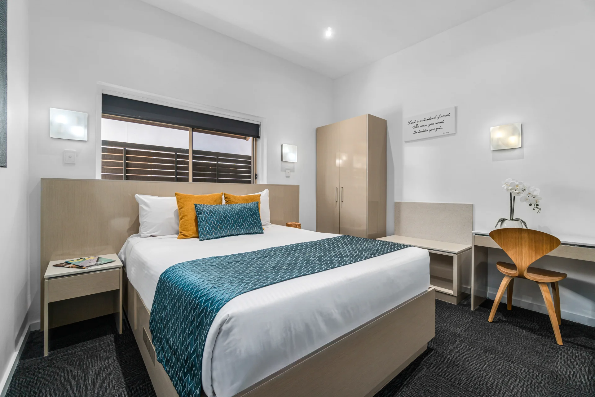 Modern Studio apartment at North Adelaide Boutique Stays Accommodation (NABSA) featuring a kitchenette, king bed, and sleek contemporary decor.